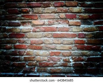 Brown Red Brick Wall Background And Texture With Vignettes And Pinhole Light