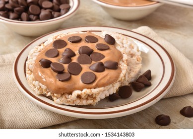 Brown Rice Cakes With Peanut Butter And Dark Chocolate Chips