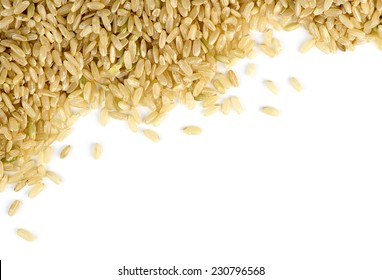 Brown Rice Scattered Against White With Copyspace