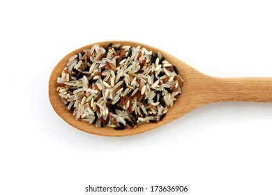 Brown rice in the spoon isolated on white background.