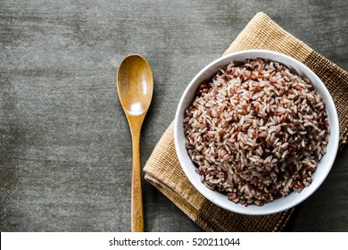 Brown Rice/Coarse Rice With Wooden Spoon. Top View.