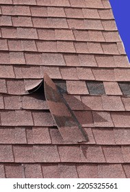 Brown Roof Shingle Damage With Sky