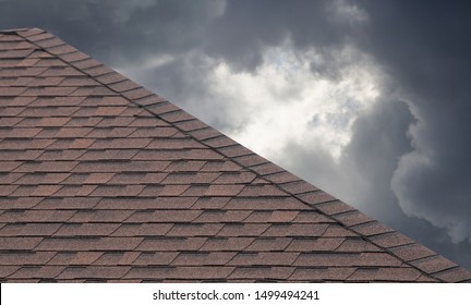 brown roof shingle on cloudy day in rainy season. - Shutterstock ID 1499494241