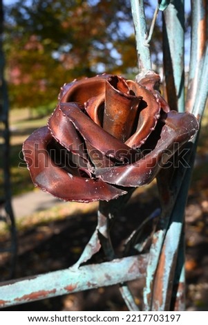 A brown rose sculpted out of metal