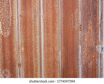 Brown rusty stain on corrugated zinc panel outdoor