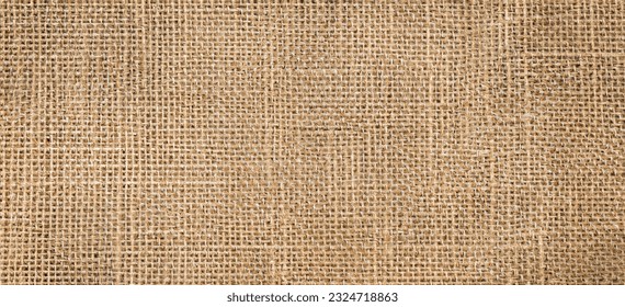 Brown sackcloth texture or background and empty space. Jute burlap canvas texture. Background for text and picture.