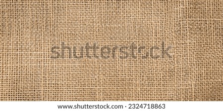 Brown sackcloth texture or background and empty space. Jute burlap canvas texture. Background for text and picture.