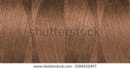 Brown sewing thread texture close up