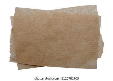 Brown sheets of baking paper isolated on white background, top view. Kraft paper for baking isolated on white background, top view. Paper for baking on a white background.