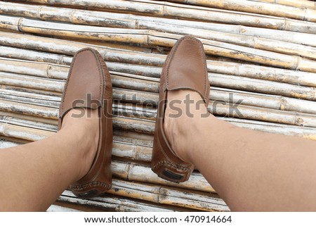 Brown shoe on bamboo wood background