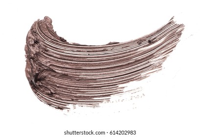 Brown Smear Of Mascara Isolated On A White Background.