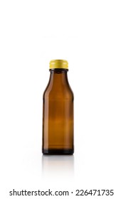 A Brown Soft Drink(vitamin C) Bottle On The Reflective Bottom Isolated White.