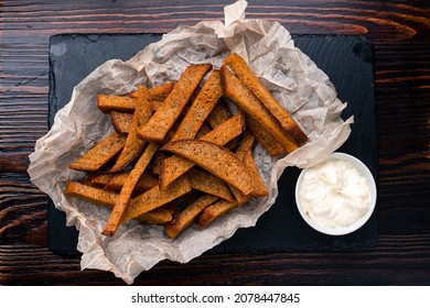 Brown spicy rye croutons sticks. Pieces of dry bread. rye bread croutons beer appetizer