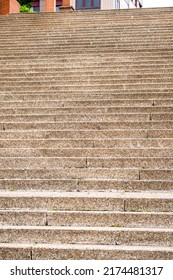 Brown Stone Staircase With Worn Steps In A City Park Close-up. Conceptual Career Growth And Development View