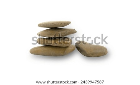 Brown stones are stacked in layers. Sea pebble. Balancing pebbles isolated on a white background with clipping path.
