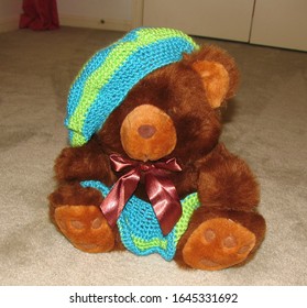 Brown Stuffed Bear Wearing Crocheted Blue And Green Beret Hat With Matching Skirt