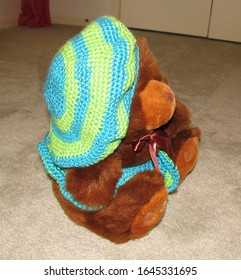 Brown Stuffed Bear Wearing Crocheted Blue And Green Beret Hat With Matching Skirt