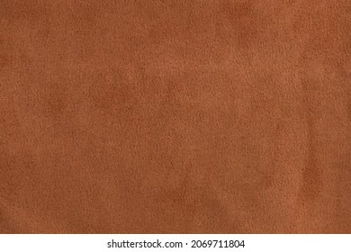 Brown suede. Brown background. Cognac color background