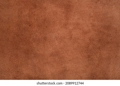 Brown suede leather texture background, genuine leather, top view. Suede texture - skin animal. Texture for design. Can be used as background wallpaper and background for design-works.