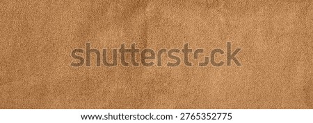 Brown suede leather texture background with soft velvet surface and natural fabric fiber details