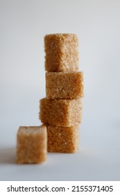 Brown Sugar In Cubes Folded In The Shape Of A Tower