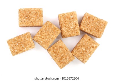 Brown Sugar Cubes Isolated On White Background. Top View. Flat Lay