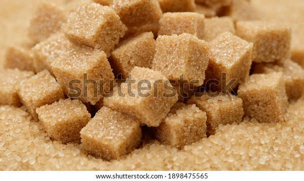 brown\
sugar cubes over sugar. Demerara golden brown\
sugar