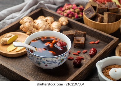 Brown sugar ginger jujube tea on the table - Shutterstock ID 2102197834