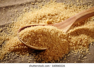 Brown Sugar Heap And Wooden Spoon 