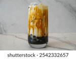 brown sugar milk boba tea on a white marble background