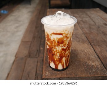 
Brown Sugar Milk Tea Glass Placed On Wood For Promotion