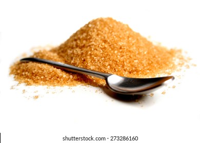 Brown Sugar And Spoon On White Background