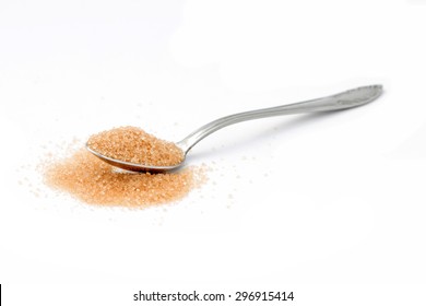 Brown Sugar In A Spoon On White