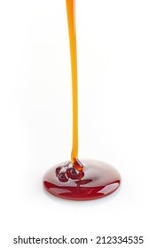 Brown Sugar Syrup Pouring Isolated On A White Background