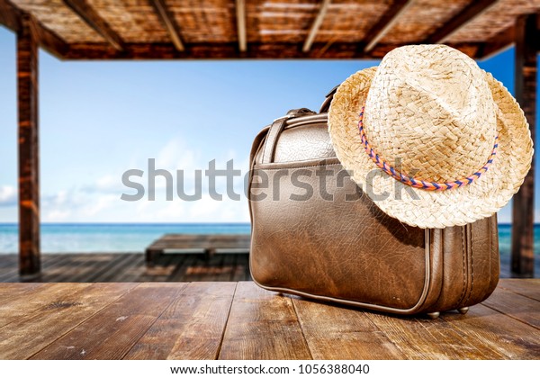 Brown suitcase of summer time and free space for your\
decoration. 