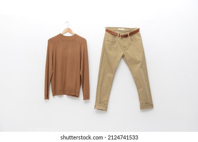 Brown Sweater With Khaki Pants O N Hanging 