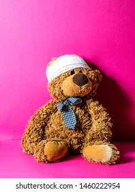 teddy bear with bandage on head