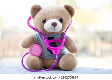 Brown teddy bears wore a stethoscope around the neck. Health care concept. And free space for your text.