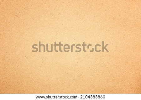 Brown textured background of a sheet of craft paper