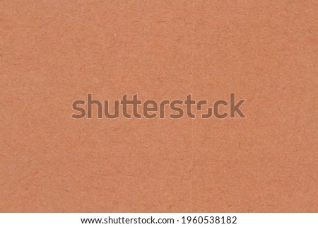 Brown textured cardstock paper background with copy space for message or use as a texture 