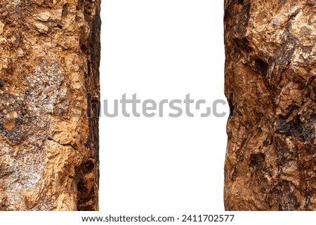 Brown textured stone walls in a rocky gorge tunnel