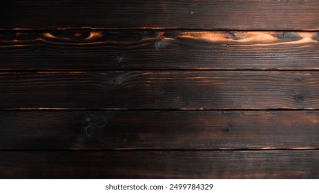 Brown textured wooden background. Free space for design or text. Top view.