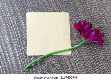 Brown Torn Paper On Wooden Surface And Sunflower Flat Lay With Copy Space.