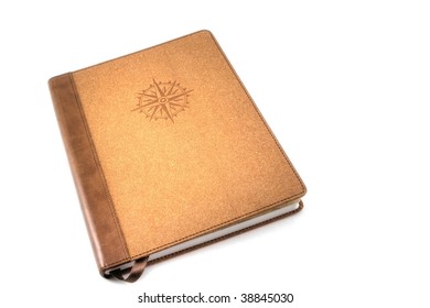 A Brown Travel Journal Imprinted With A Compass Rose, Isolated On White.