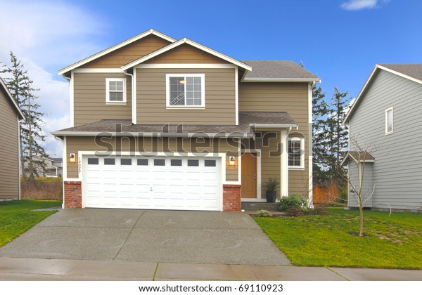 Brown Two Level House Large Garage Stock Photo Edit Now 69110923