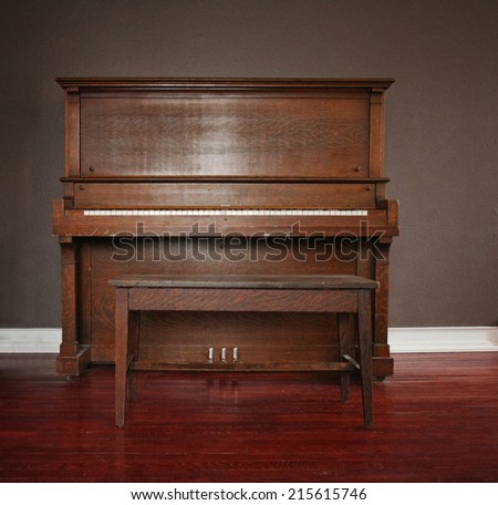 brown upright piano in a living room