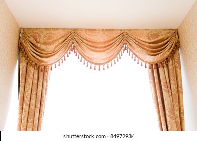 brown velvet theater curtains in a room over white background.