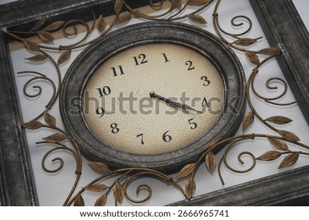 Brown vintage clock with square frame and bronze leaves elegant aged timepiece symbolizing the passage of time reflection on life importance of time classic antique décor and timeless elegance