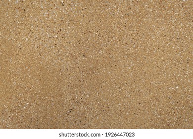 A brown wall of granite crumbs is like a background.