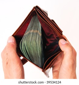 A Brown Wallet Full Of Money Isolated On A White Background